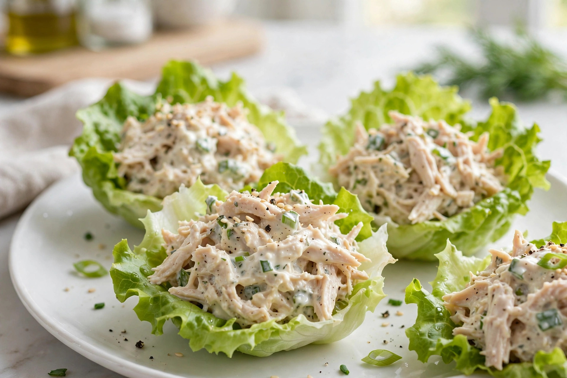 Butter lettuce cups filled with shredded chicken salad