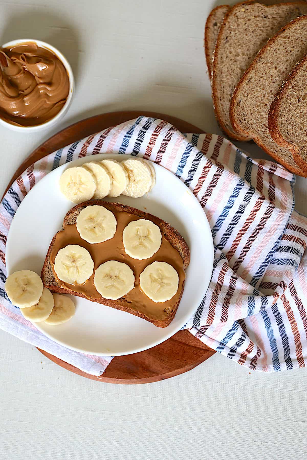 Whole-grain toast spread with peanut butter and topped with banana slices